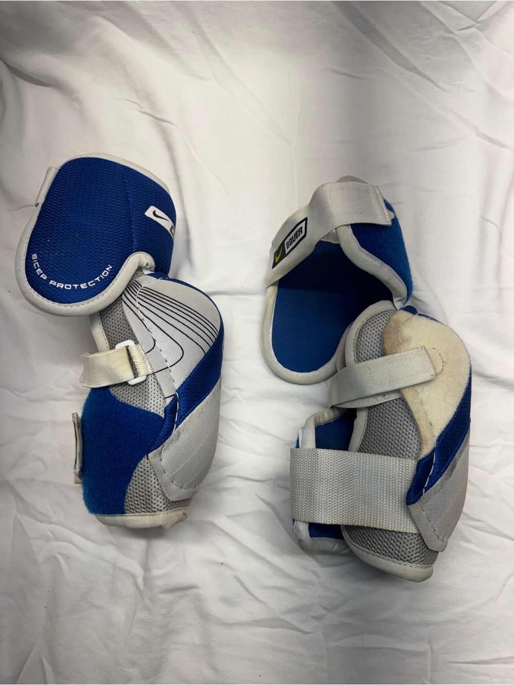 Nike Bauer Blue and White elbow/bicep Guards with Straps. Hockey